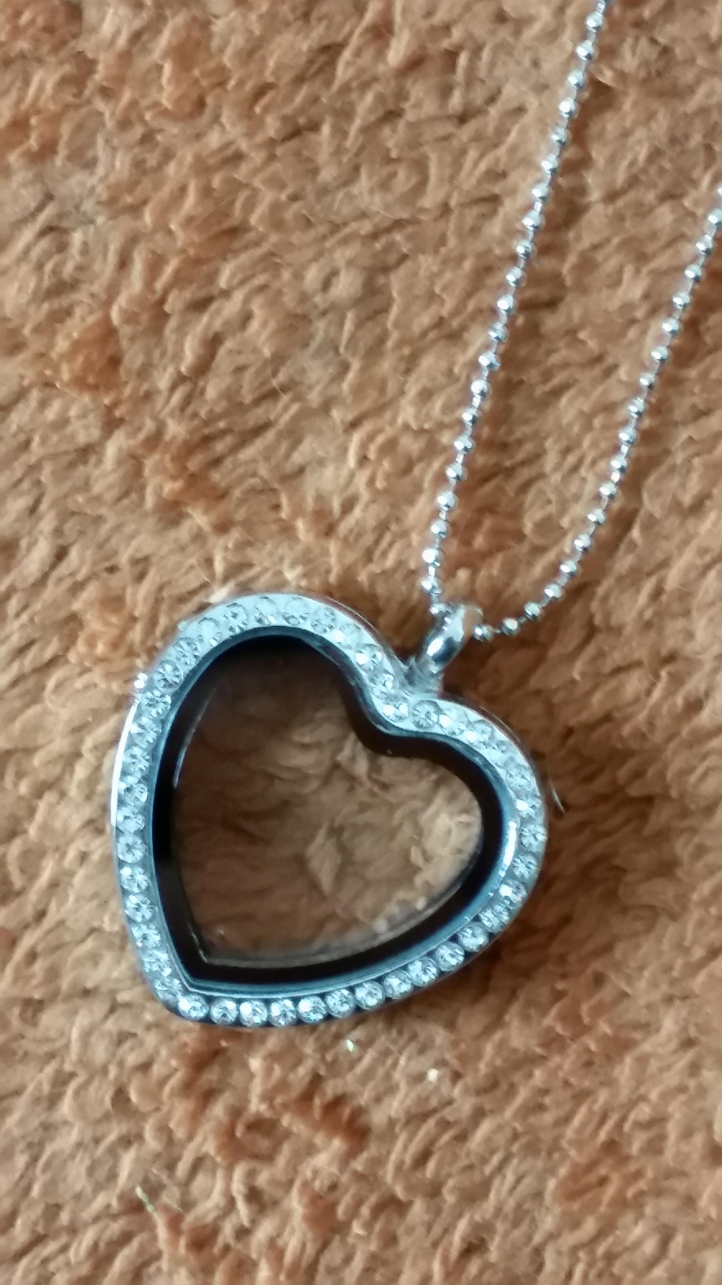 Gorgeous gem stone heart locket with shiny cubic zirconias along the outsides of the heart, customize & personalize it any way that you want!