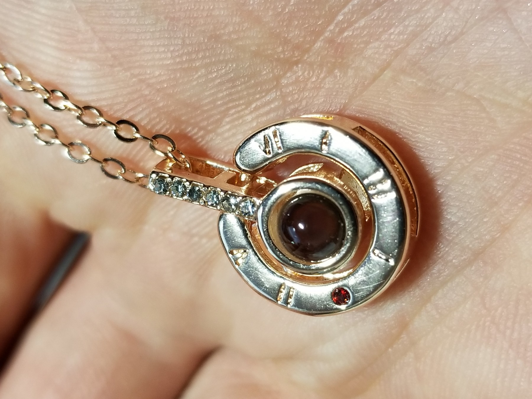 A nice rose gold necklace with a nice surprise hidden in the lens.