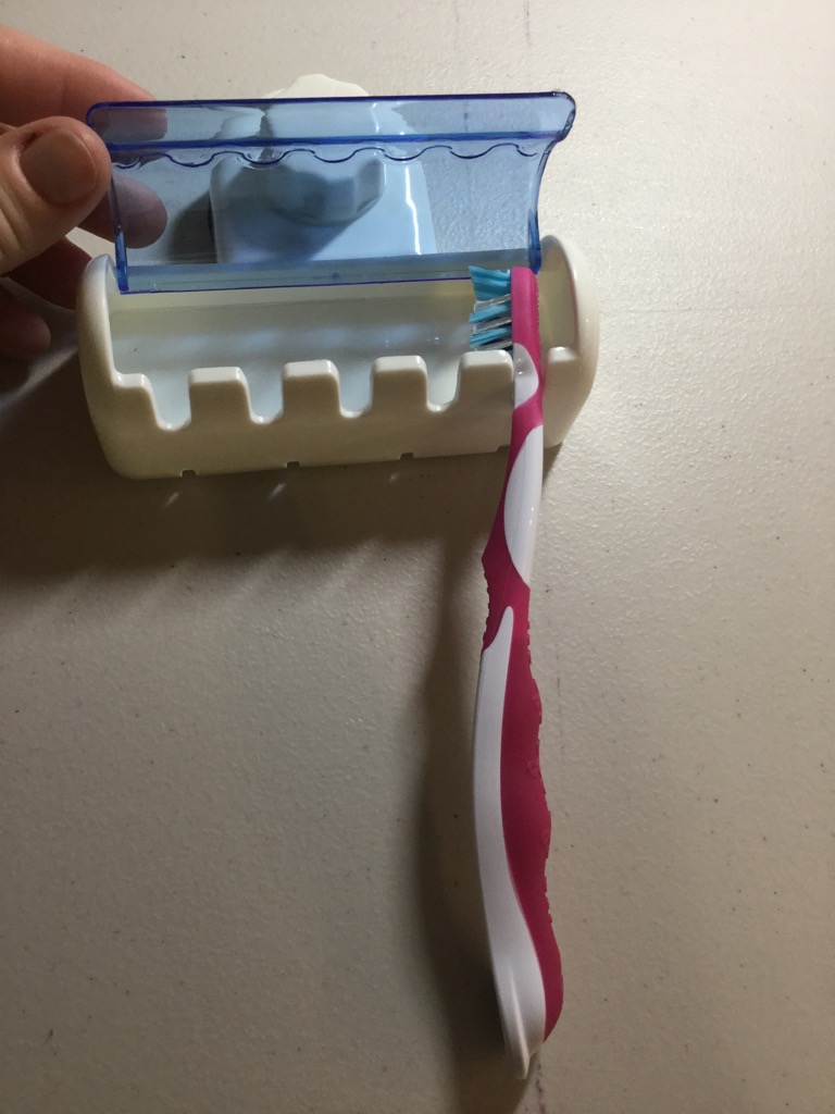 A great way to get the toothbrushes off the sink